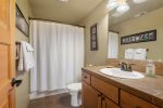 Queen guest bath, tile counter tops, shower tub combo, upper level
